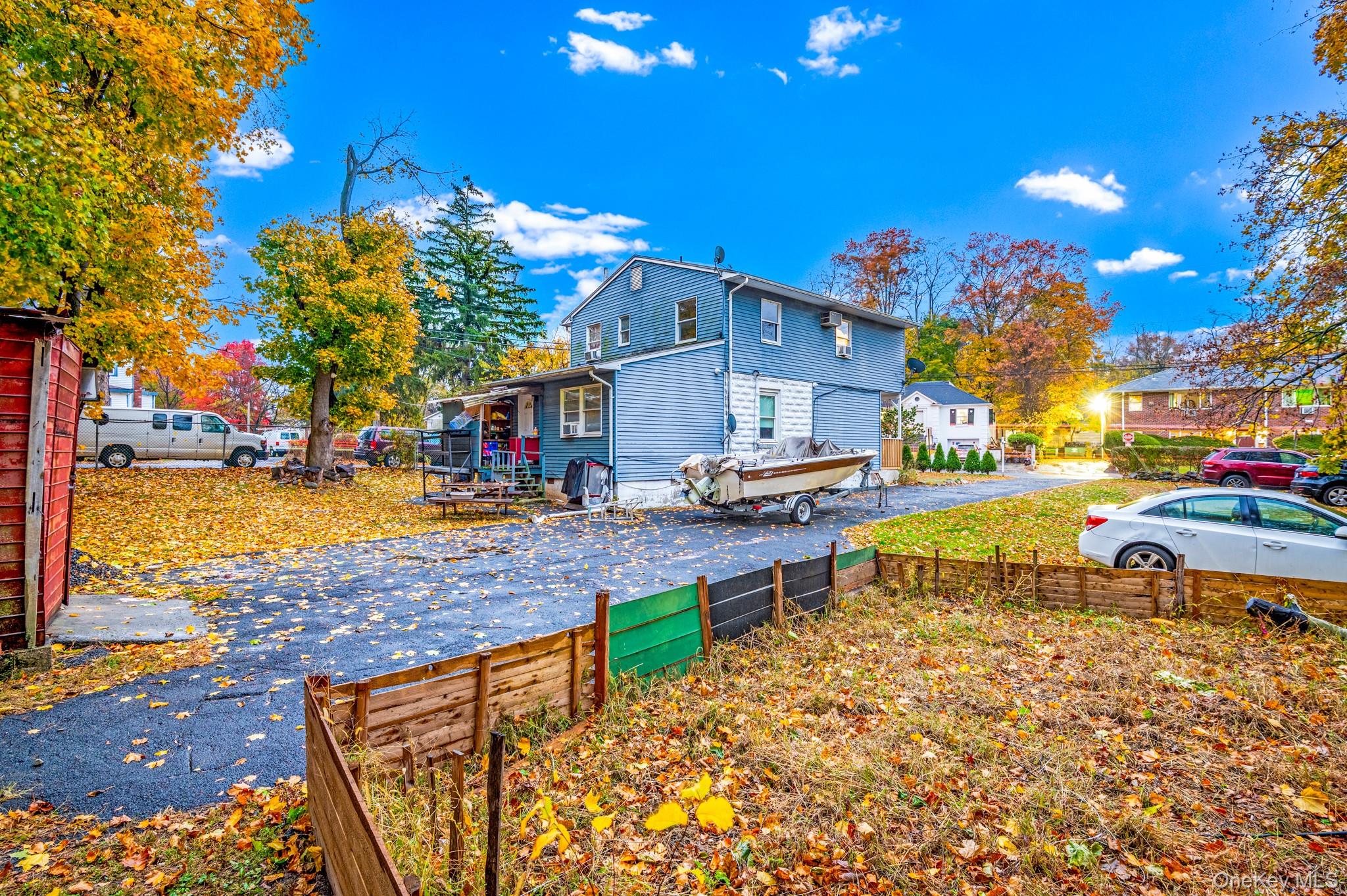 17 Division Avenue Spring Valley, NY 10977 - Photo 3 of 4 a view of a swimming pool with an outdoor space and seating area