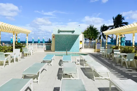 a lobby with furniture and floor to ceiling window