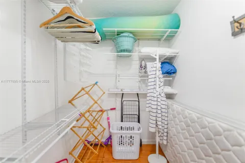 a bedroom with a bed and a large window with outer view