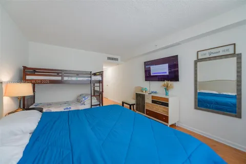 a bedroom with a bed and a closet