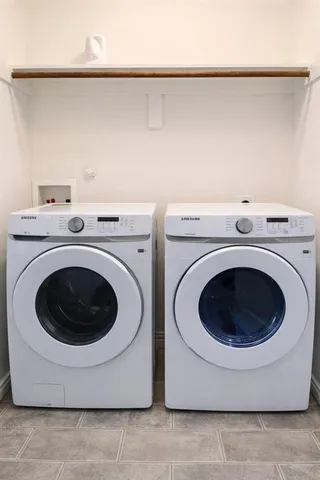 a utility room with dryer and washer