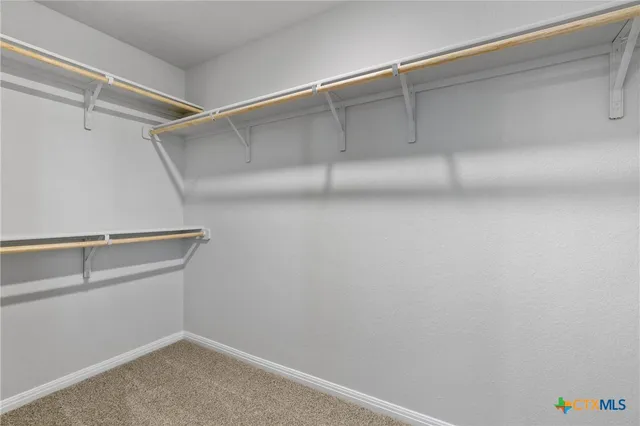 a view of an empty walk in closet