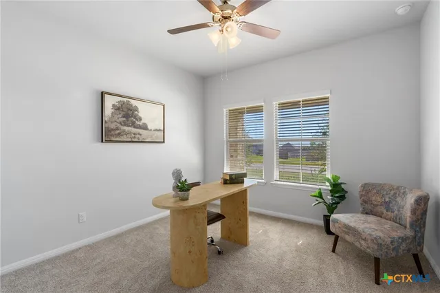 a dining room with furniture and window