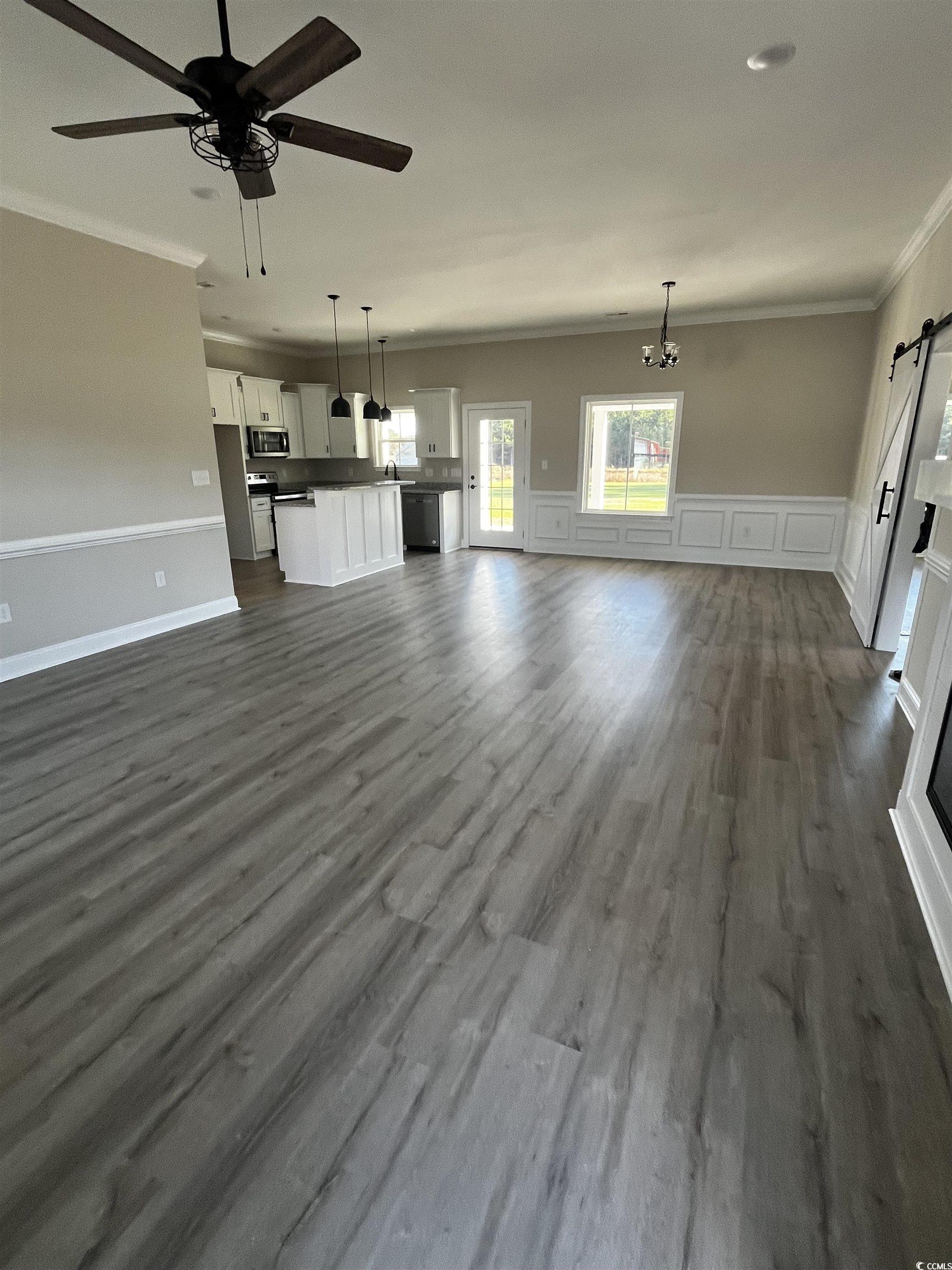 5639 Carriage Road Conway, SC 29527 - Photo 3 of 9 Unfurnished living room featuring ceiling fan with