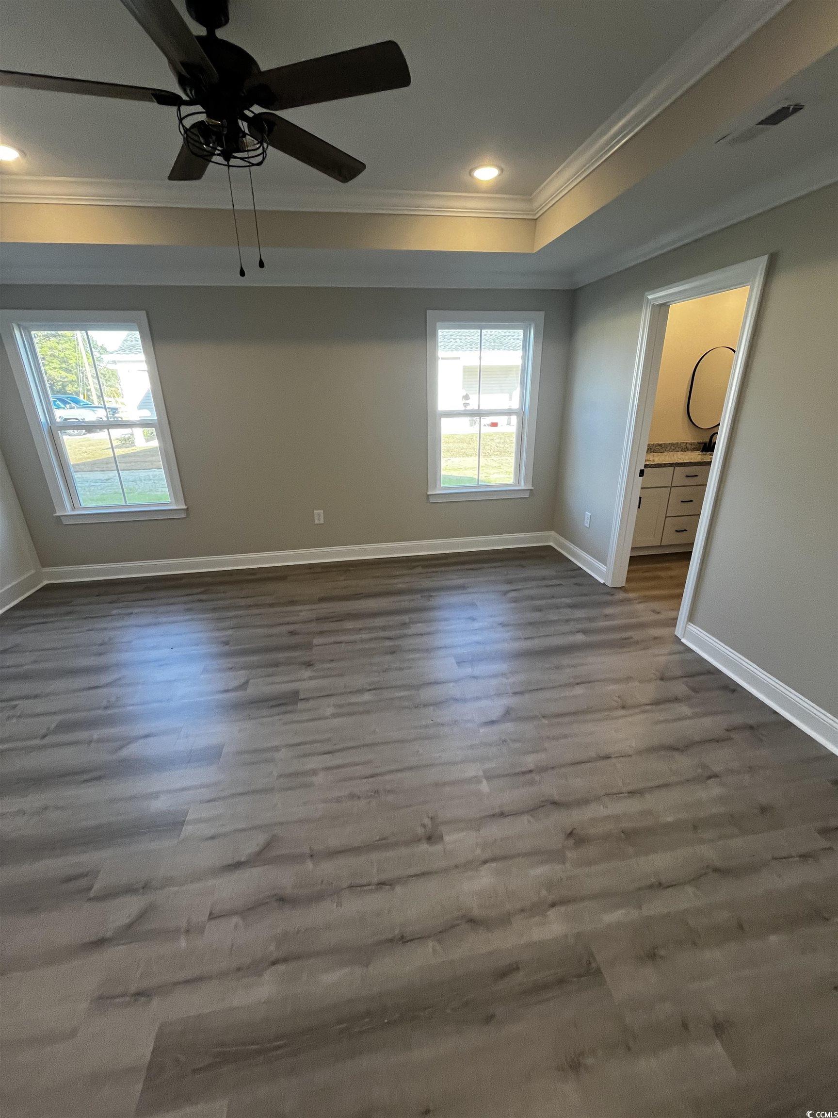 5639 Carriage Road Conway, SC 29527 - Photo 4 of 9 Unfurnished room with crown molding, ceiling fan,