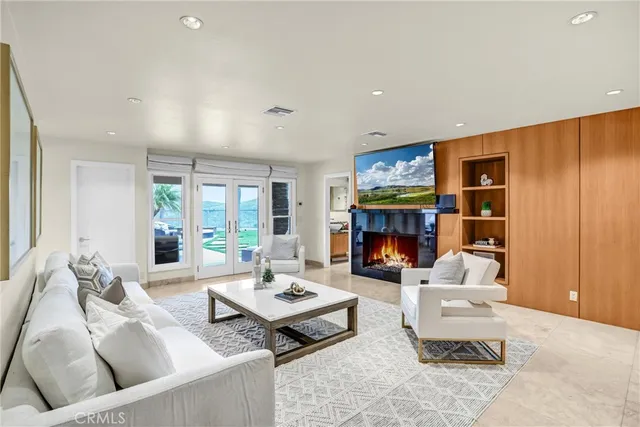 a large kitchen with stainless steel appliances granite countertop a sink and cabinets