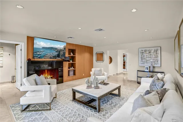 a open kitchen with stainless steel appliances granite countertop a stove and a refrigerator