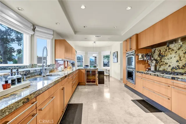 a living room with furniture a large window with outer view