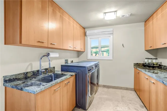 a living room with furniture a flat screen tv and a window