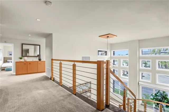 a spacious bedroom with a bed a couch and a window