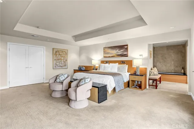 a bathroom with a granite countertop sink mirror and a toilet