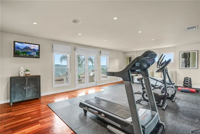 a view of a house with pool and sitting area