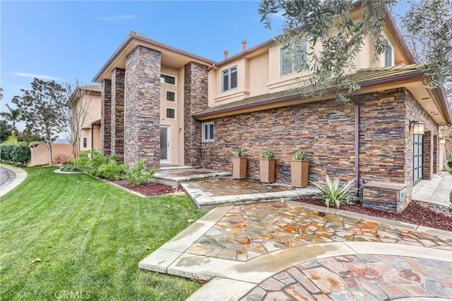 a view of a dining room with furniture a rug and a window
