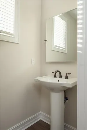 a bathroom with a sink and a window