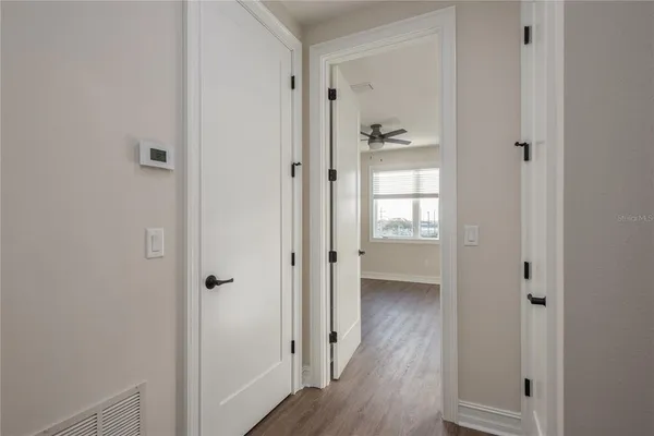 a view of a bathroom with wooden floor