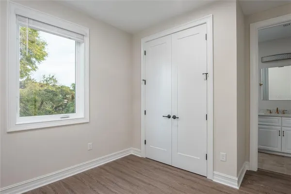a bathroom with a sink vanity and mirror