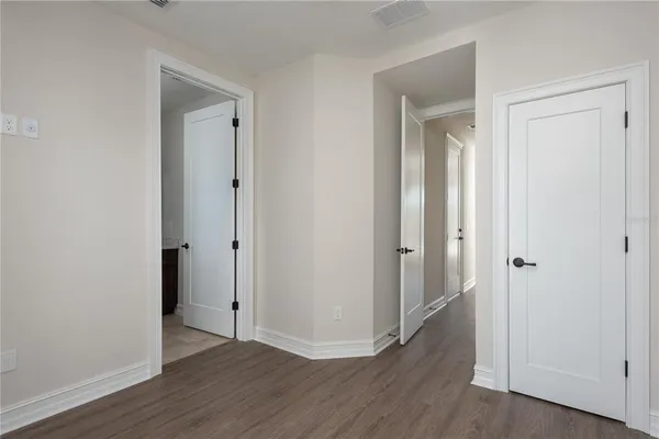 a bathroom with a shower and a sink