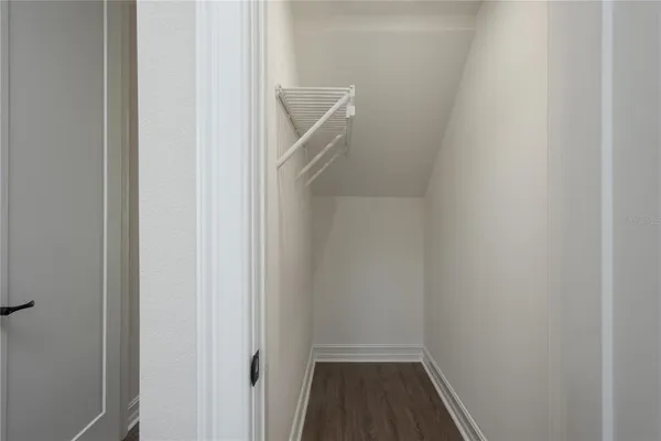 a view of an empty walk in closet