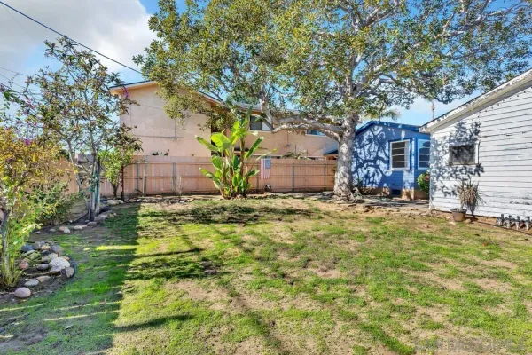 a backyard of a house with lots of green space
