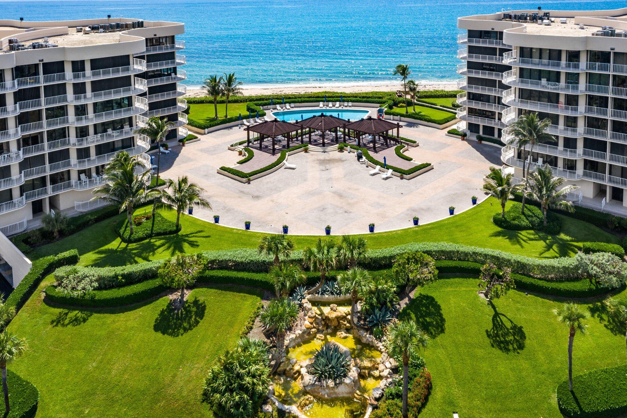 3400 South Ocean Boulevard, Unit 7AII Palm Beach, FL 33480 - Photo 23 of 33 a view of a swimming pool with a yard