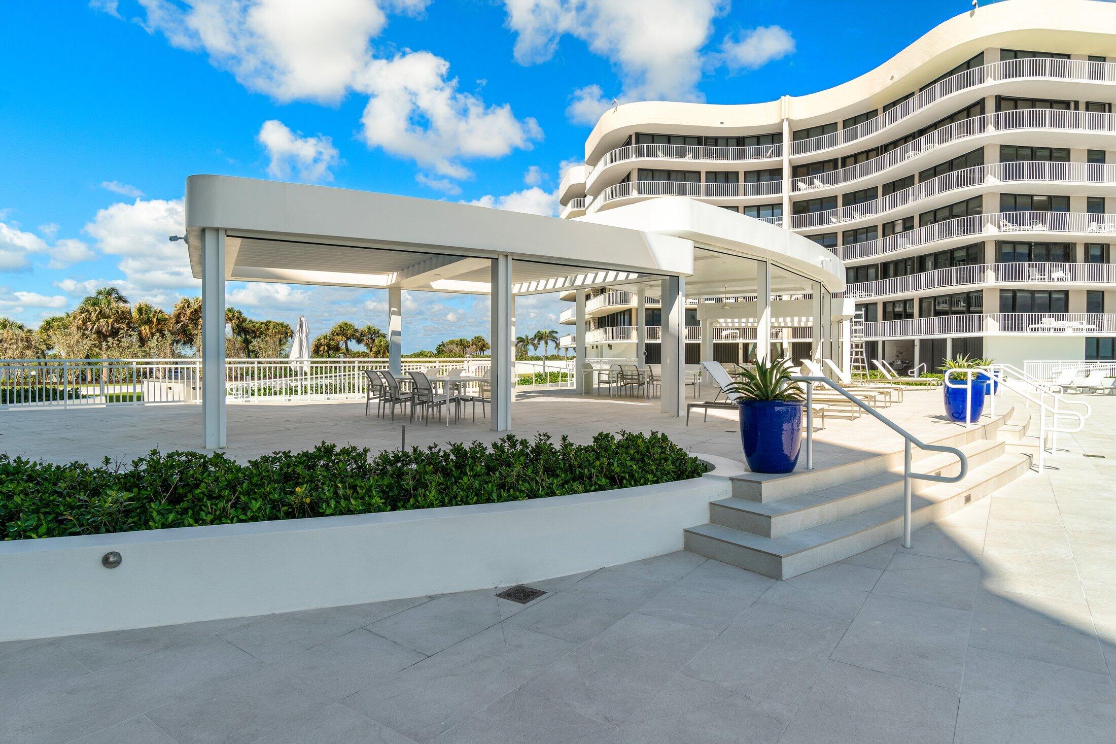 3400 South Ocean Boulevard, Unit 7AII Palm Beach, FL 33480 - Photo 32 of 33 a view of tall building with large tree