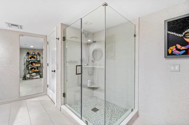 a bathroom with a shower and a sink