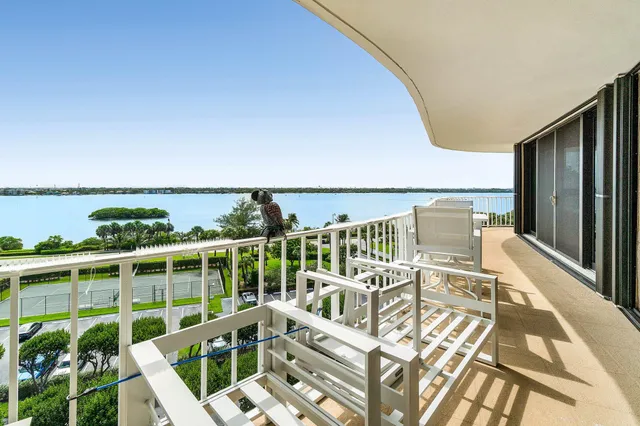 a view of a balcony with chairs