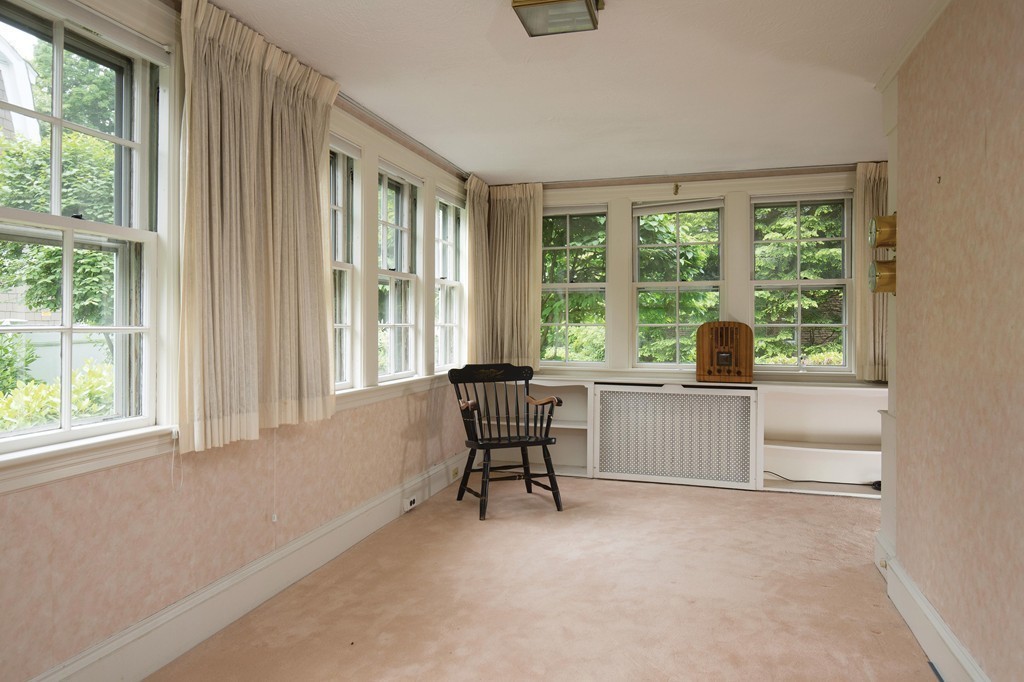 21 Pilgrim Road Newton, MA 02468 - Photo 3 of 10 a view of a work space with wooden floor and a floor to ceiling window