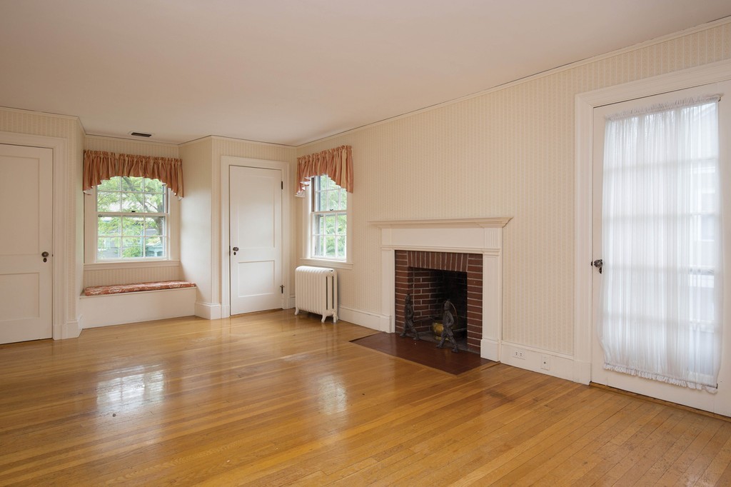 21 Pilgrim Road Newton, MA 02468 - Photo 6 of 10 a view of a livingroom with a fireplace and window