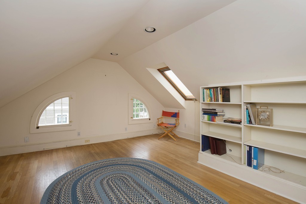 21 Pilgrim Road Newton, MA 02468 - Photo 7 of 10 a view of an empty room with window and wooden floor
