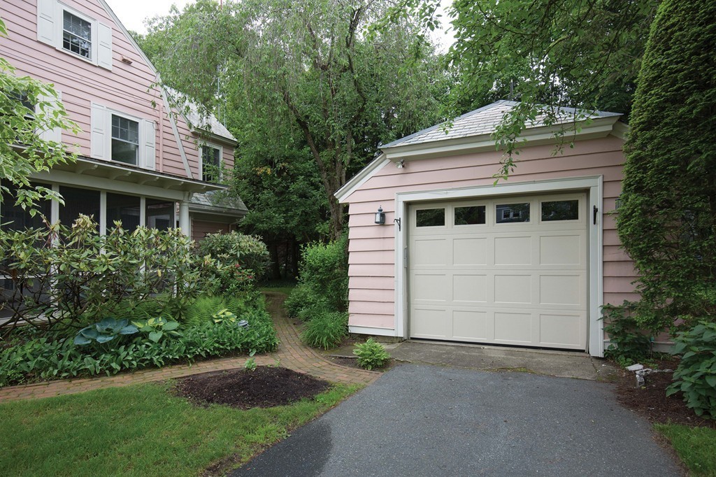 21 Pilgrim Road Newton, MA 02468 - Photo 10 of 10 a front view of a house with a yard and garage