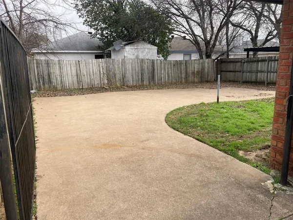 a view of backyard with green space