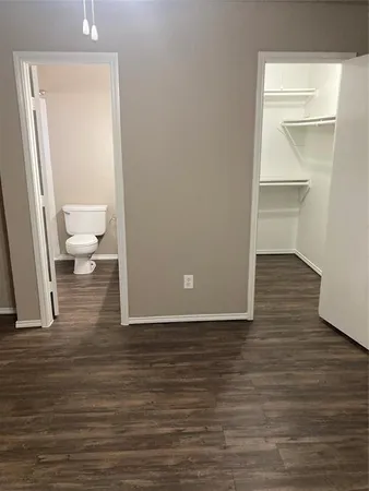 a view of a bathroom with wooden floor