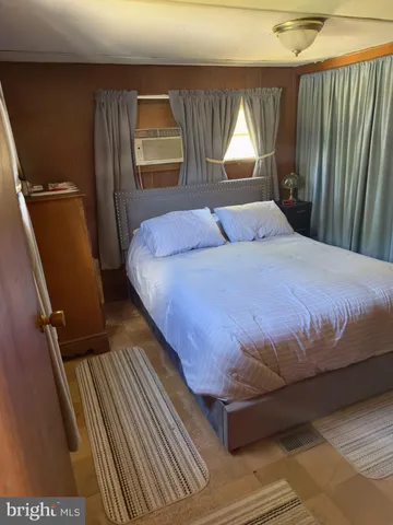 a kitchen with a stove a refrigerator and a sink