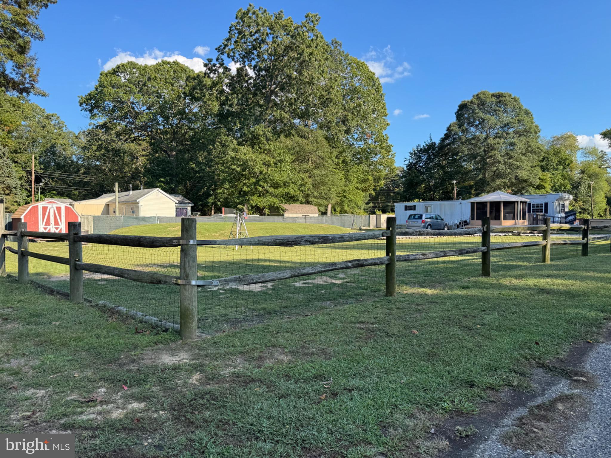 538 Fern Road Millville, NJ 08332 - Photo 2 of 18 Spacious yard with rustic charm and greenery.