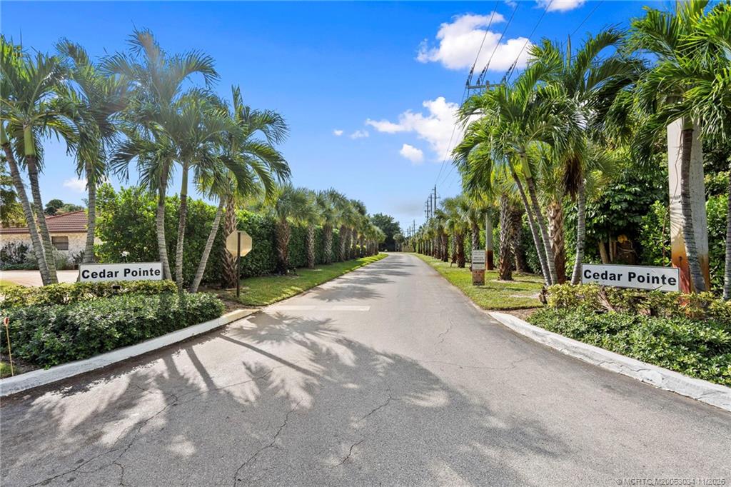 2929 Southeast Ocean Boulevard, Unit 1397 Stuart, FL 34996 - Photo 2 of 38 a view of a garden with a tree