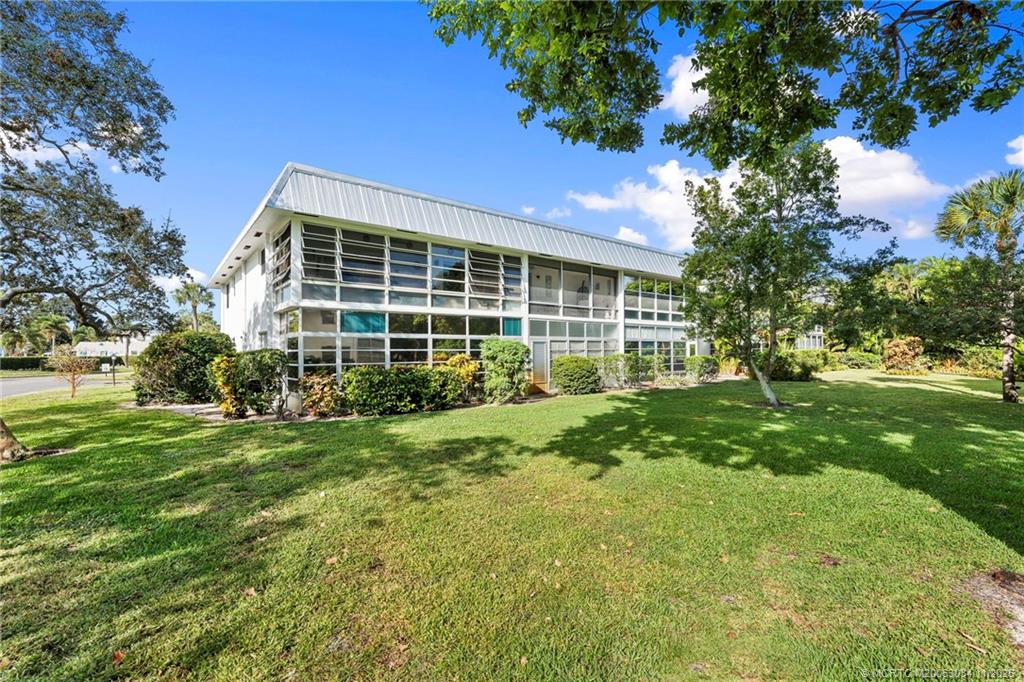 2929 Southeast Ocean Boulevard, Unit 1397 Stuart, FL 34996 - Photo 27 of 38 a view of a house with yard and sitting area