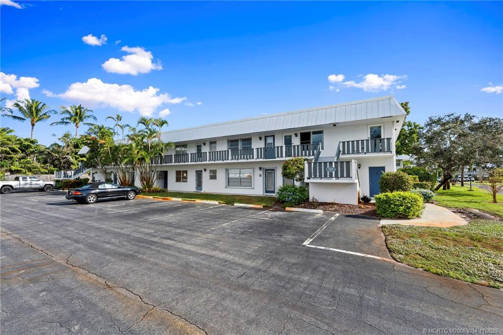 2929 Southeast Ocean Boulevard, Unit 1397 Stuart, FL 34996 - Photo 3 of 38 a view of a house with a yard and sitting area