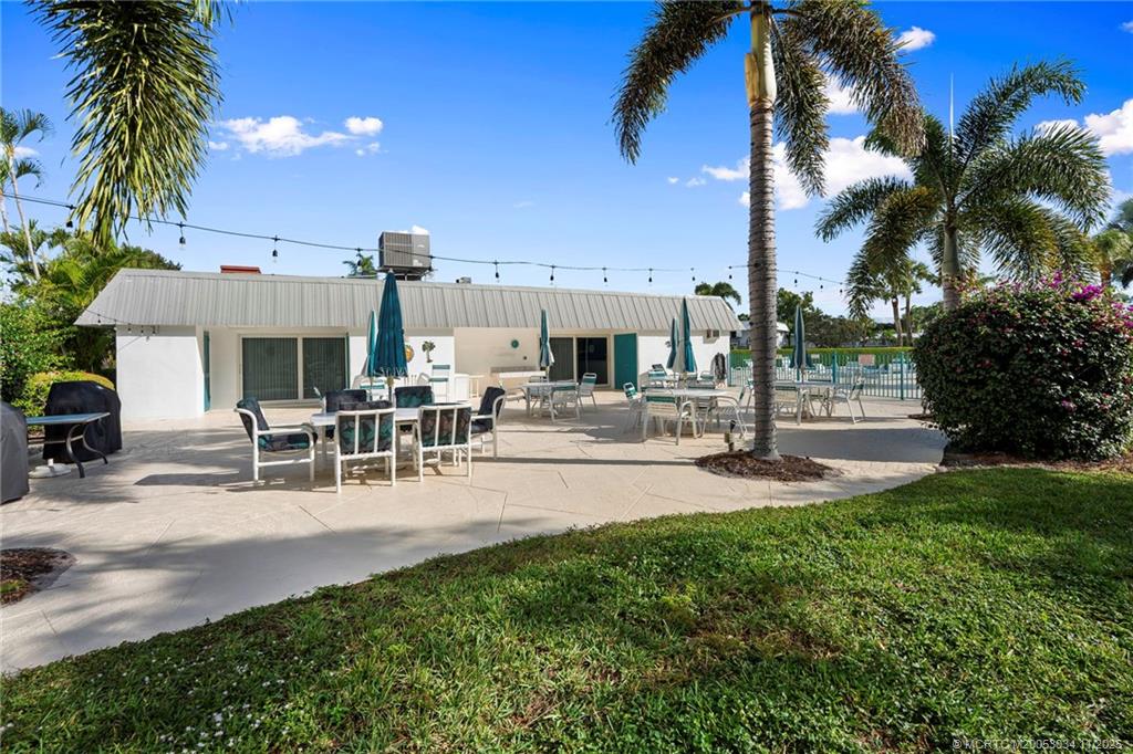 2929 Southeast Ocean Boulevard, Unit 1397 Stuart, FL 34996 - Photo 33 of 38 a view of a backyard and swimming pool