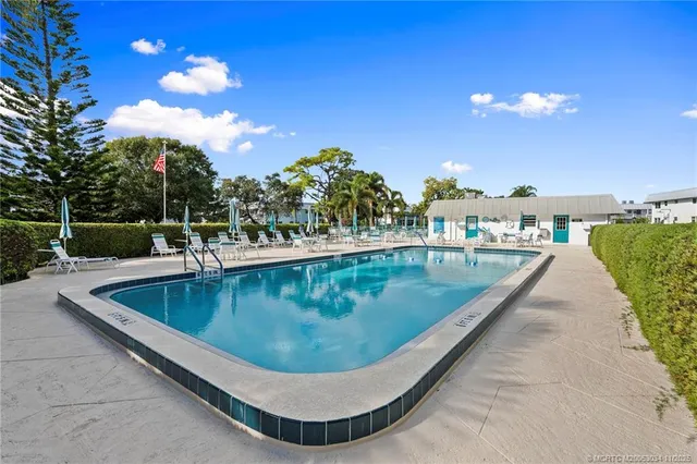 a view of a swimming pool with a lounge chairs