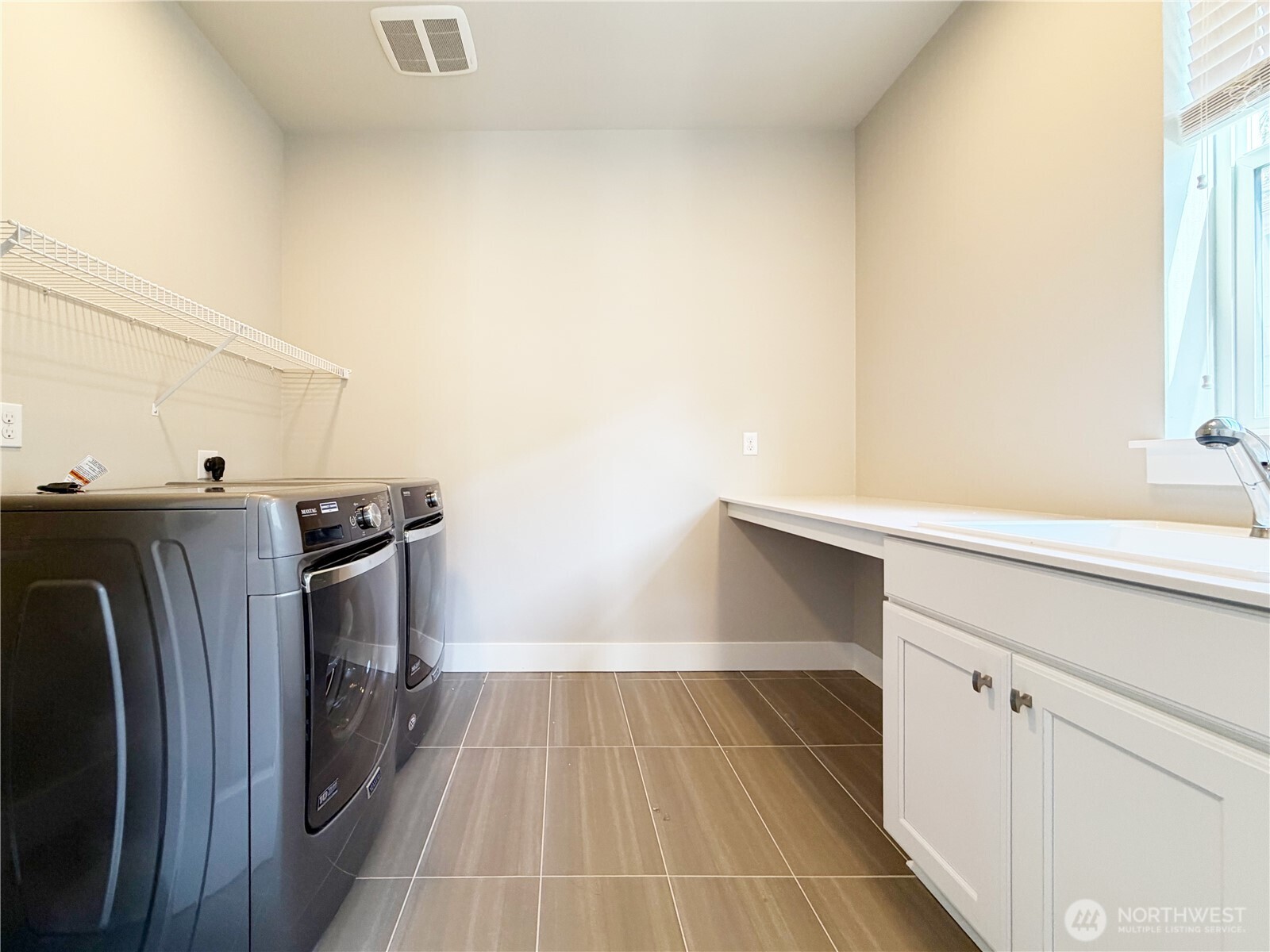16529 White Mountain Road Southeast Monroe, WA 98272 - Photo 27 of 34 a utility room with dryer and washer
