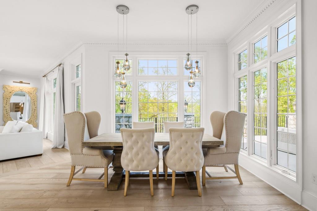 515 Tullamore Way Alpharetta, GA 30004 - Photo 14 of 71 a view of a dining room with furniture window and wooden floor
