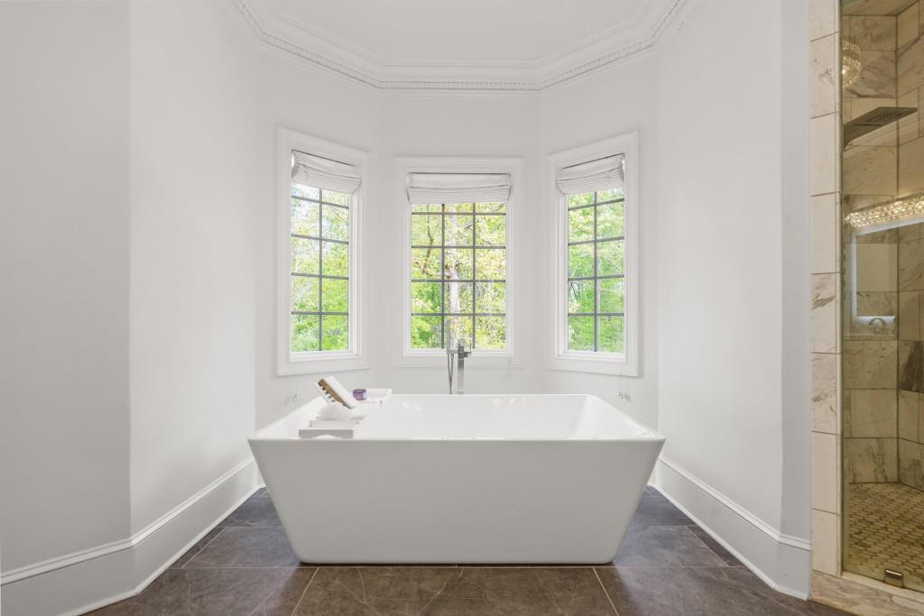 515 Tullamore Way Alpharetta, GA 30004 - Photo 22 of 71 a white bath tub sitting in a bathroom next to a window