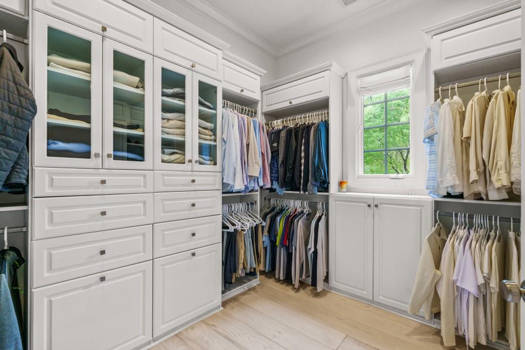 515 Tullamore Way Alpharetta, GA 30004 - Photo 24 of 71 a view of walk in closet with clothes and shoes