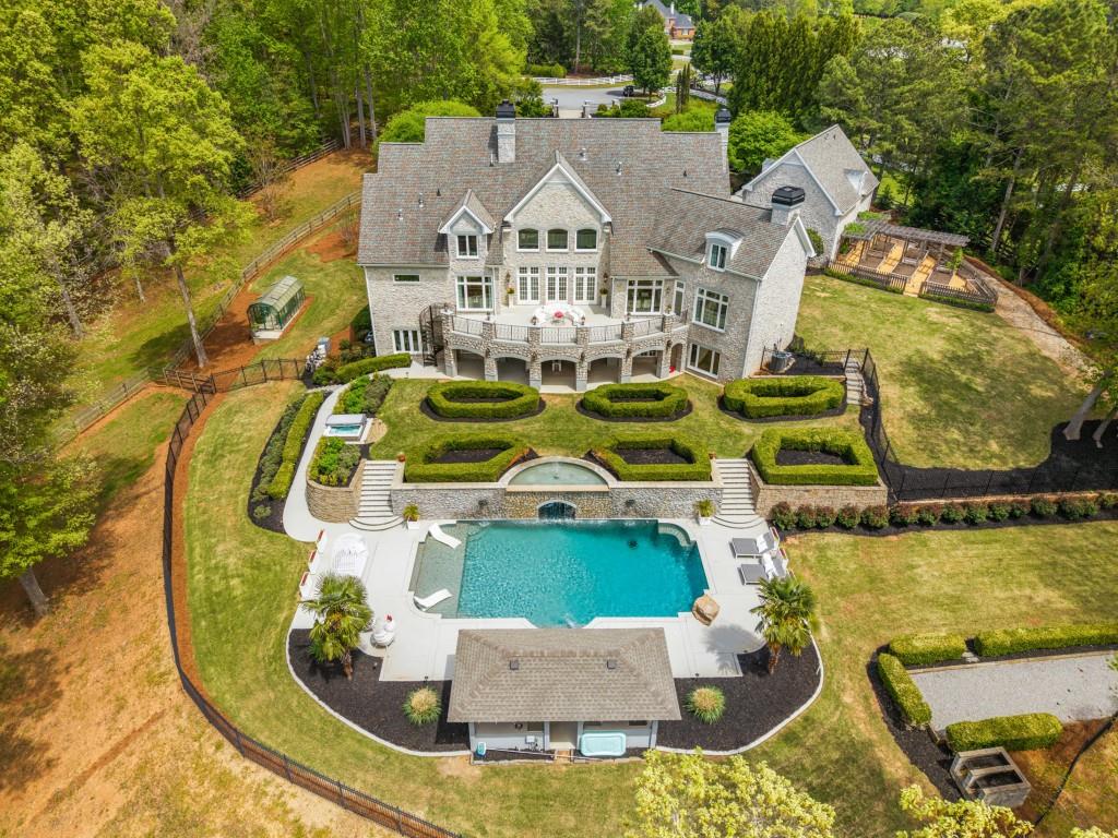 515 Tullamore Way Alpharetta, GA 30004 - Photo 51 of 71 an aerial view of a house with swimming pool and large trees