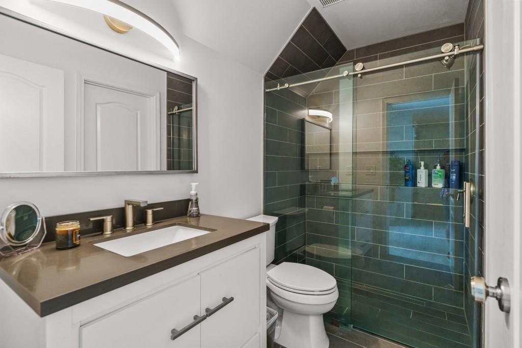515 Tullamore Way Alpharetta, GA 30004 - Photo 56 of 71 a bathroom with a sink and a toilet