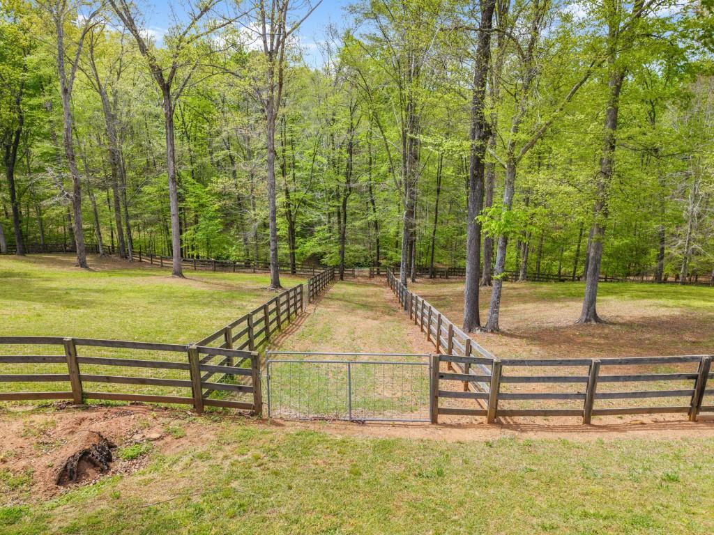 515 Tullamore Way Alpharetta, GA 30004 - Photo 58 of 71 a view of a tennis ground with large trees