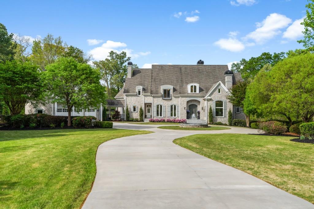 515 Tullamore Way Alpharetta, GA 30004 - Photo 65 of 71 a view of a house with a big yard and large trees