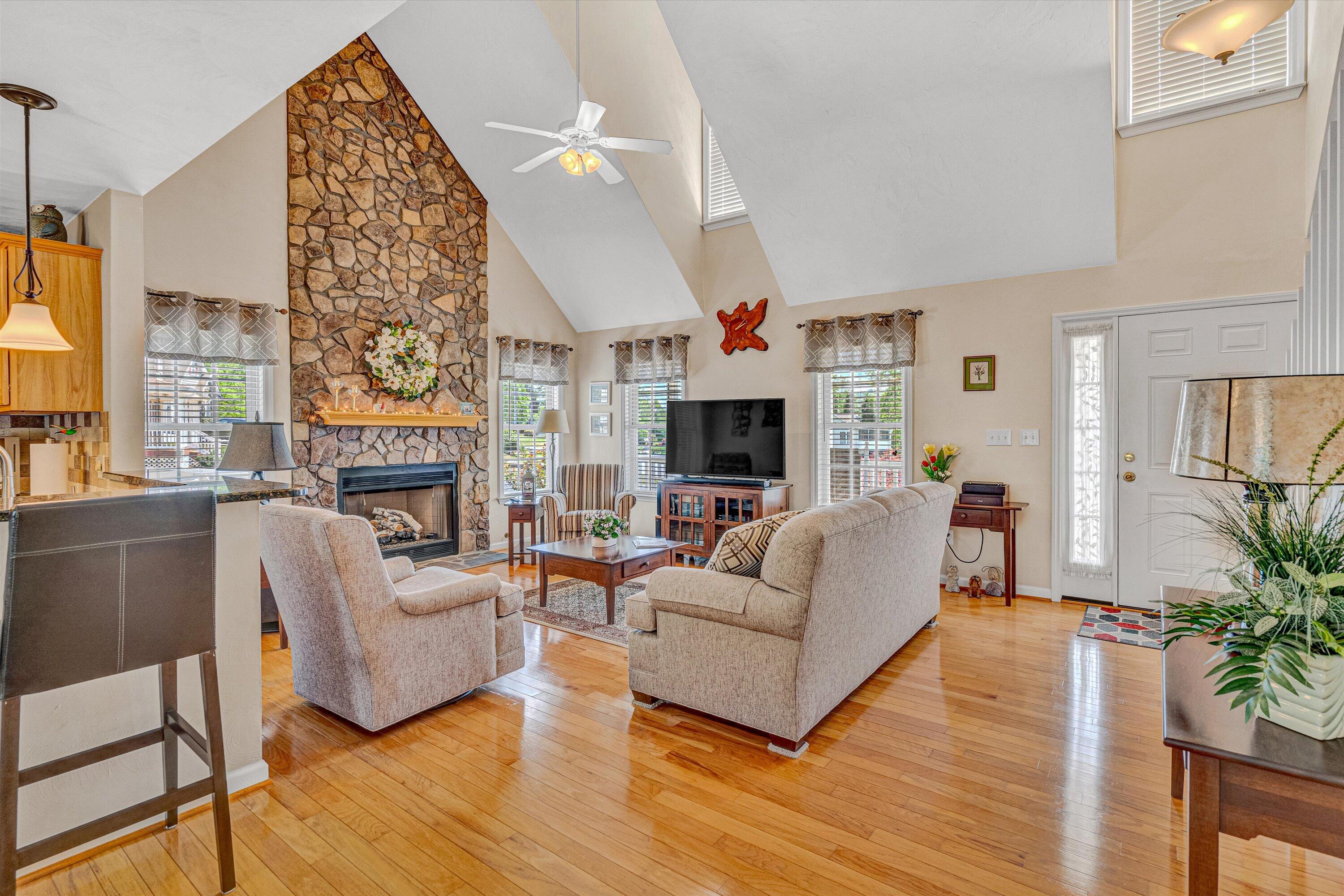 1304 Virginia Ridge Drive Hardy, VA 24101 - Photo 11 of 33 a living room with furniture a large window and a fireplace