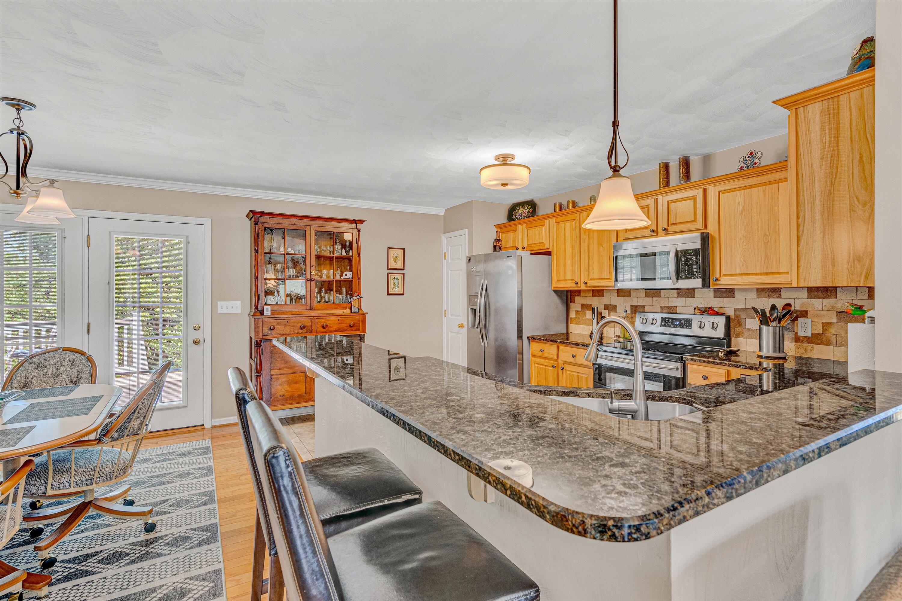 1304 Virginia Ridge Drive Hardy, VA 24101 - Photo 13 of 33 a view of a kitchen with kitchen island granite countertop a large window and a sink